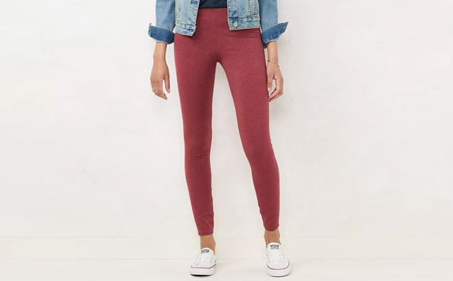 A Woman Wearing Lauren Conrad Midrise Leggings in Red Heather Color