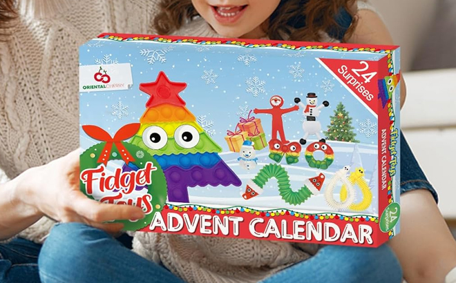 A Child Holding the Fidget Toys Advent Calendar Box