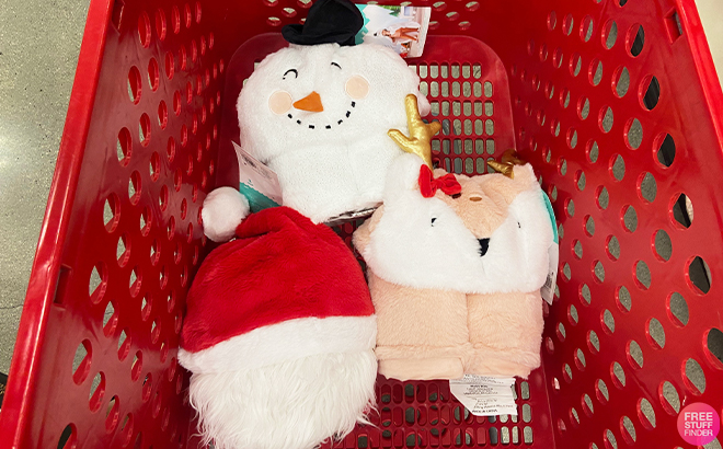 All Three Pillowfort Christmas Blankets in a Target Shopping Cart
