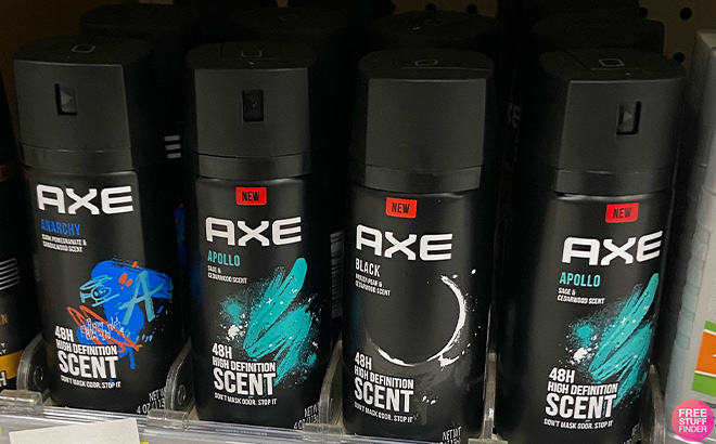 Hand Holding Axe Deodorant Body Spray Blue Lavender in a Store Aisle Axe Deodorants Body Sprays in the Store