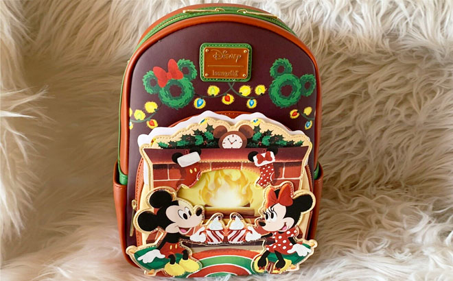 Disney Loungefly Mickey and Minnie Backpack on a Sherpa White Blanket