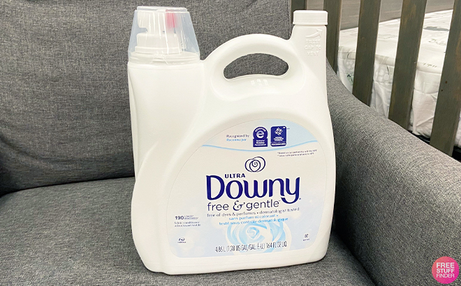 Downy Free Gentle Laundry Fabric Conditioner Fabric Softner 164 Fl Oz 190 Loads on a Sofa