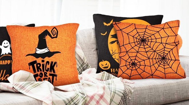 Four Halloween Pillows on a Sofa Chair