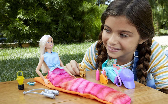 Girl is Playing with Barbie It Takes Two Doll Accessories Malibu Camping Playset with Doll