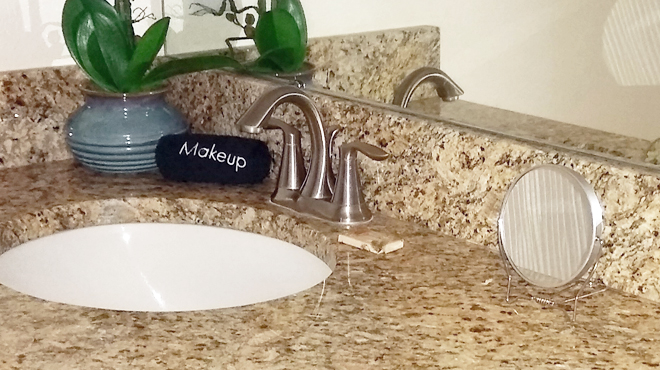 Goody Two Sided Makeup Mirror on a Bathroom Counter