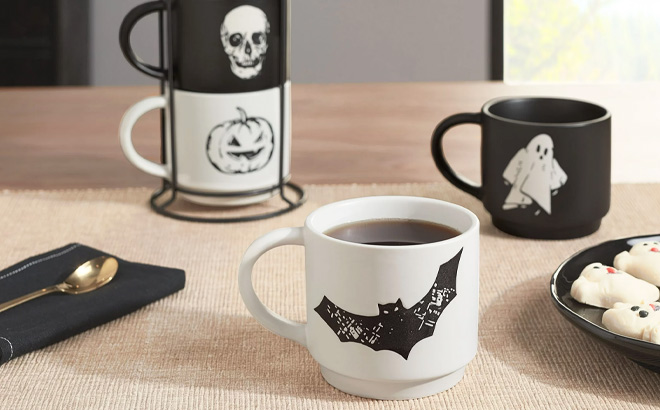 Halloween Black and White Halloween Icons Glazed Ceramic Stacking Mug Set with Metal Rack on the Table