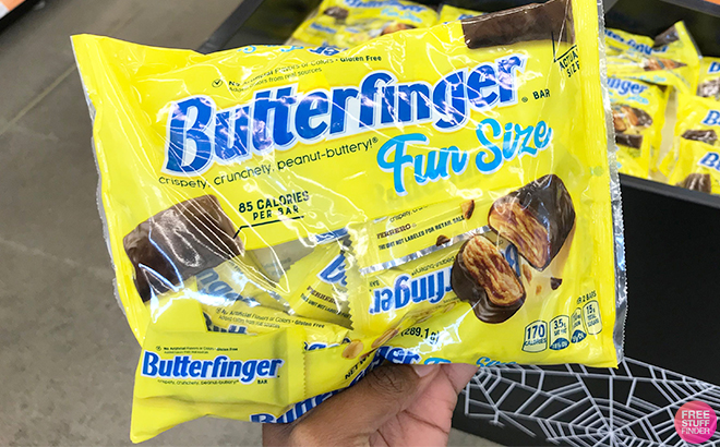 Hand Holding Butterfinger Chocolate Bars Fun Size Bag at Walgreens
