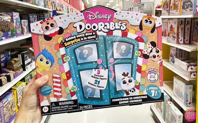 A Hand Holding the Disney Doorables 2023 Advent Calendar at Target