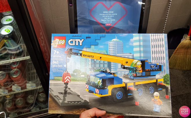 Hand Holding LEGO City Mobile Crane Building Set