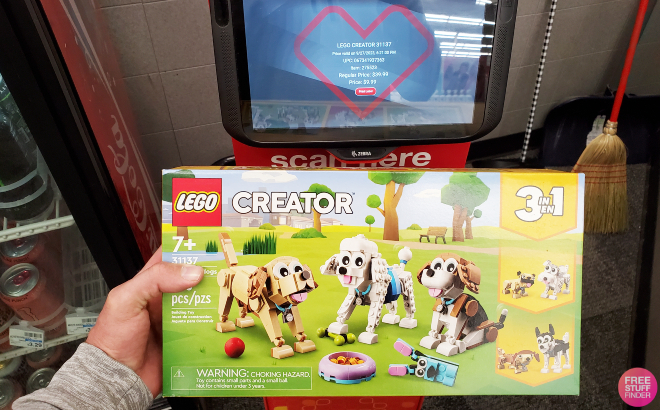 Hand Holding LEGO Creator Adorable Dogs Building Set