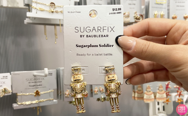 Hand Holding Sugarfix by Baublebar Sugarplum Soldier Earrings