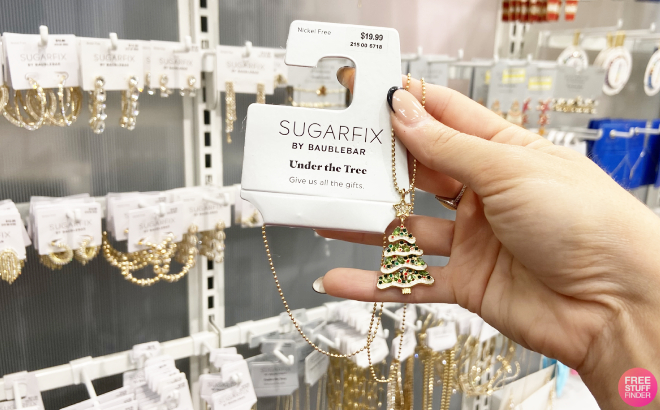 Hand Holding Sugarfix by Baublebar Under the Tree Pendant Necklace