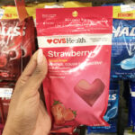 Hand Holding a Bag of CVS Health Strawberry Cough Drops