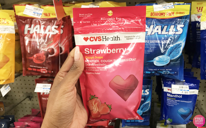 Hand Holding a Bag of CVS Health Strawberry Cough Drops