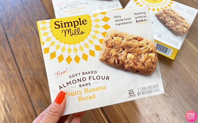 Hand Holding a Box of Simple Mills Soft Baked Almond Flour Bars