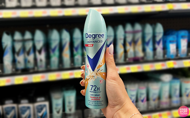 Hand Holding a Degree Dry Spray Deodorant for Women