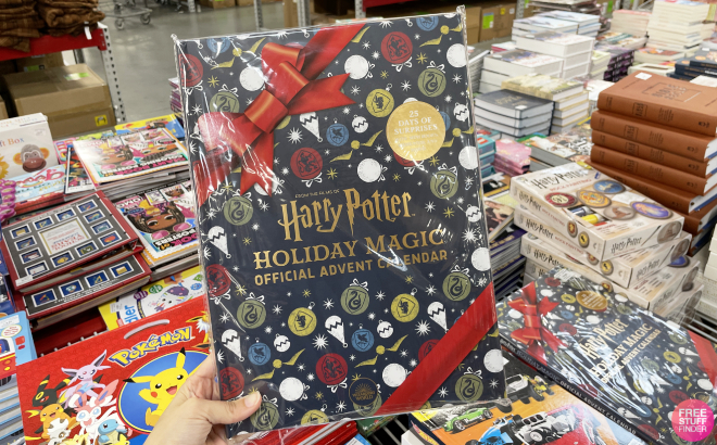 A Hand Holding the Harry Potter Holiday Magic Advent Calendar at a Store