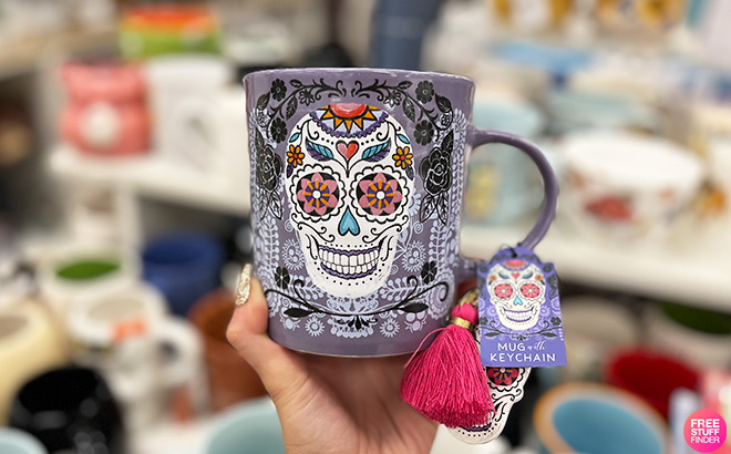 Hand Holding a Light Purple Sugar Skull Ceramic Mug