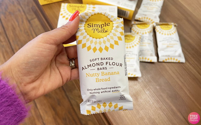 Hand Holding a Simple Mills Soft Baked Almond Flour Bar