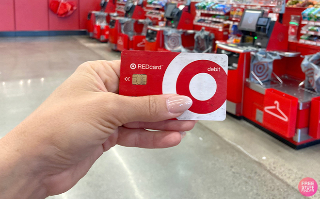 Hand Holding a Target RedCard inside a Target Store
