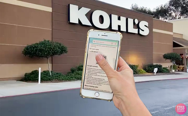Hand Holding iPhone with QR Code In Front of Kohls Store Sign