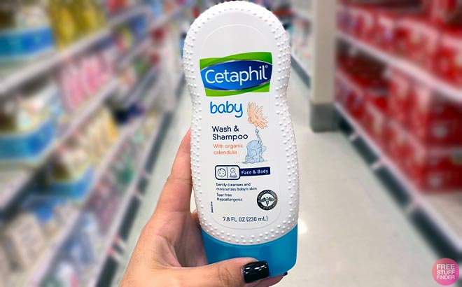 Hand holding Cetaphil Baby Wash and Shampoo