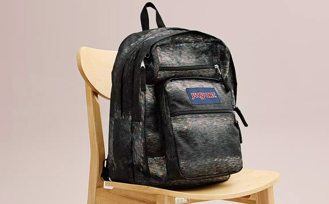 JanSport Big Student Backpack on a Wooden Chair