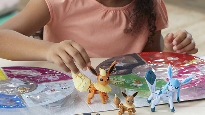 Kid playing Mega Pokemon 470 pc Action Figure Building Kit