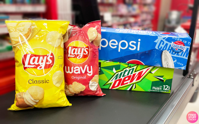Lays Potato Chip Pepsi Drinks and Mountain Dew Drinks on a Conveyor Belt Lays Potato Chip Pepsi Drinks and Mountain Dew Drinks on a Conveyor Belt