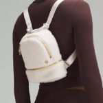 Model Wearing Lululemon City Adventurer Backpack Micro 3L in White