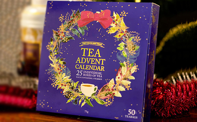 New English Teas Christmas Tea Advent Calendar with Christmas Decorations in the Background