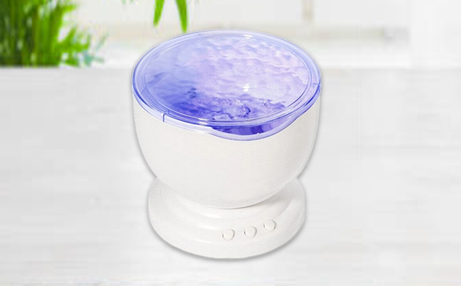Ocean Wave Night Light Projector Speaker on a Table