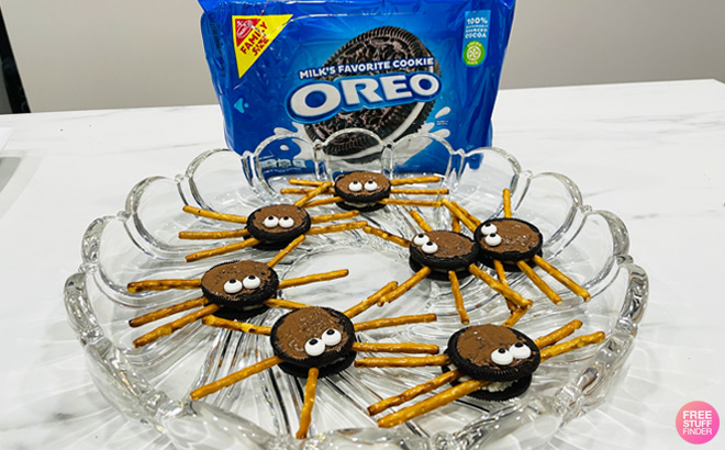 Oreo Spider Cookies in Glass Plate next to Bag of Oreos