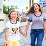 People Walking Through Disney Themed Park