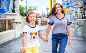 People Walking Through Disney Themed Park