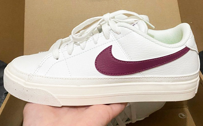 Person Holding Nike Court Legacy Next Nature Womens Shoes