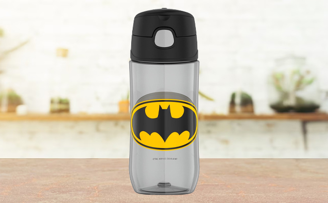 https://www.freestufffinder.com/wp-content/uploads/2023/09/Thermos-Funtainer-Batman-16-Ounce-Plastic-Hydration-Bottle-on-a-Table.jpg