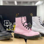 Three Pairs of Dr Martens 1460 Boots on Shoe Boxes