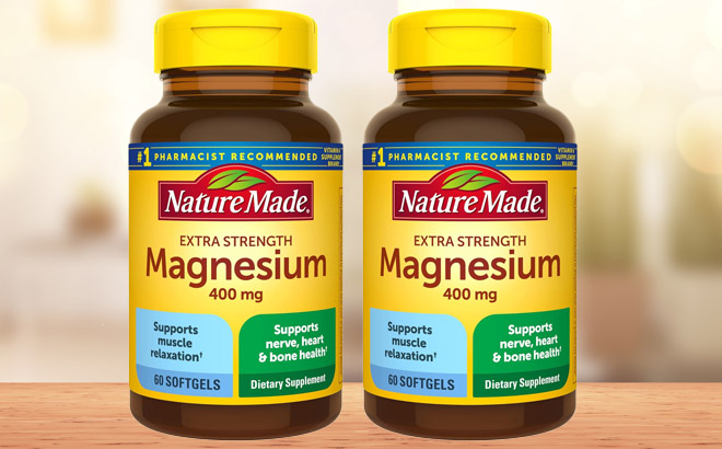 Two Counts of Nature Made Magnesium Dietary Supplement Bottle on a Wooden Table