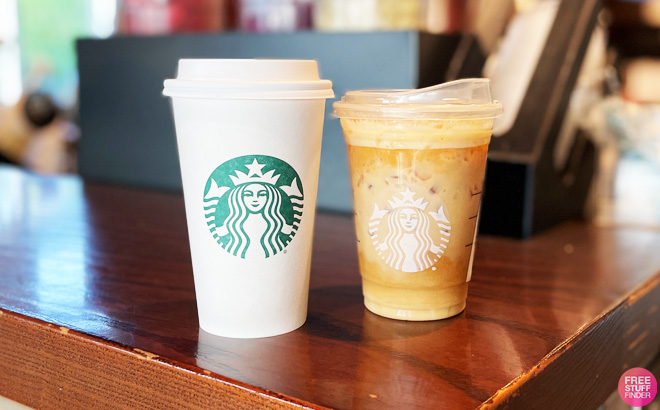 Two Starbucks Coffee on a Wooden Table