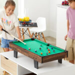 Two kids playing pool on BCP 11 in 1 Combo Game Table Set