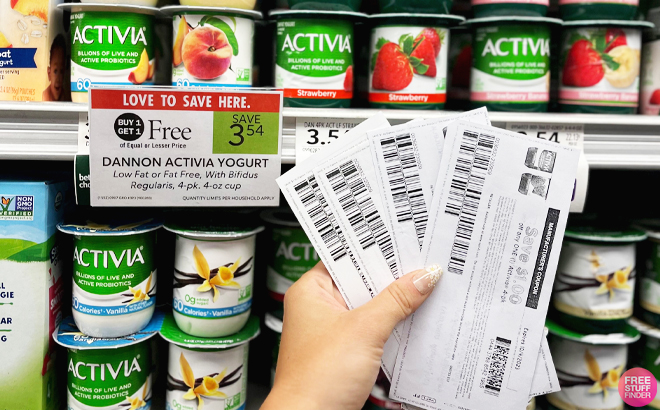 Woman Holding Coupons for Activia Probiotic Low Fat Yogurt 4 Packs