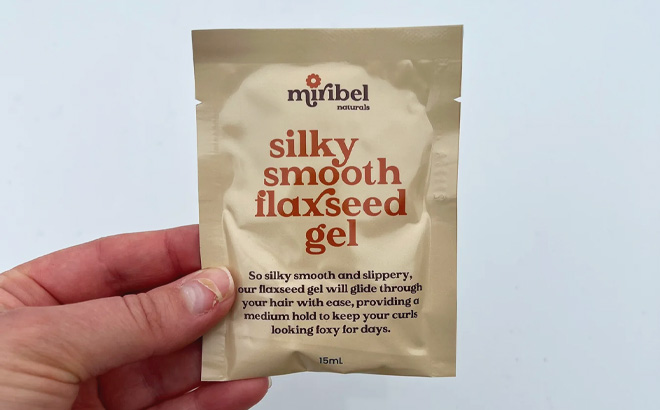 Woman Holding a Silky Smooth Flaxseed Gel Sample