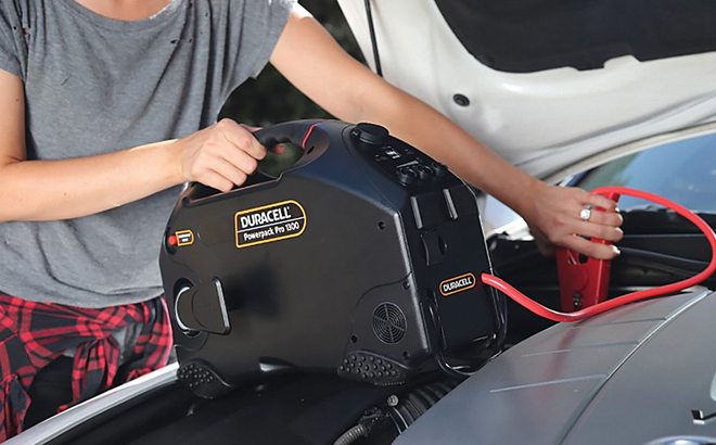 Woman Using the Duracell Powerpack Pro 1300 Amp Jumpstarter