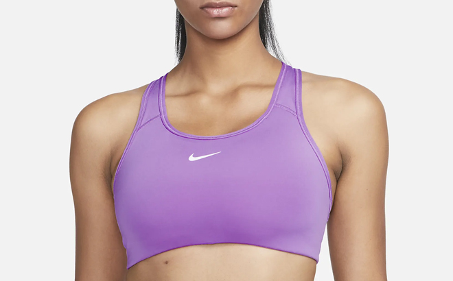 Woman Wearing Nike Swoosh Medium Support Pad Sports Bra Woman Wearing Nike Swoosh Medium Support Pad Sports Bra