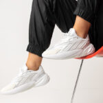 Woman is Wearing Adidas Ozelia Shoes in Cloud and Crystal White Color