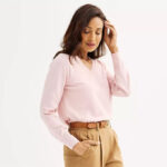 Woman is Wearing Croft Barrow Extra Soft V Neck Sweater in Barely Pink Heather Color