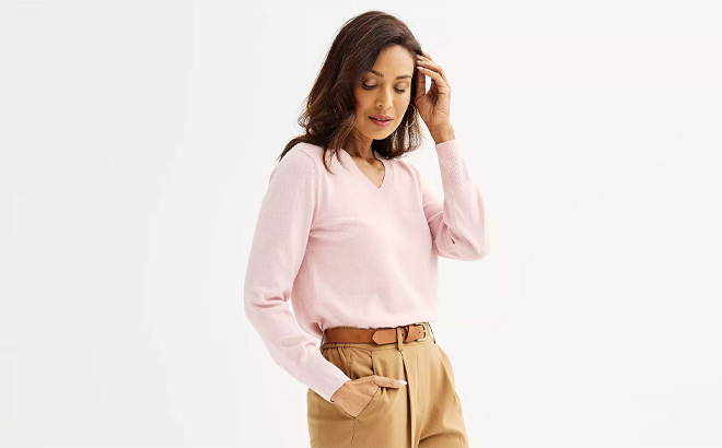 Woman is Wearing Croft Barrow Extra Soft V Neck Sweater in Barely Pink Heather Color