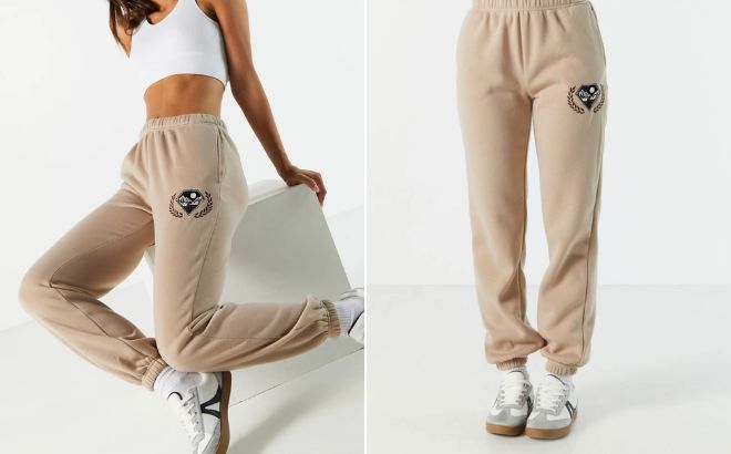 Woman is Wearing Mountain Embroidered Fleece Jogger in Taupe Color Woman is Wearing Mountain Embroidered Fleece Jogger in Taupe Color