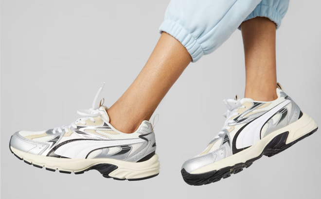 Woman is Wearing Puma Milenio Tech Mens Sneakers in Warm White PUMA White PUMA Silver Color Woman is Wearing Puma Milenio Tech Mens Sneakers in Warm White PUMA White PUMA Silver Color